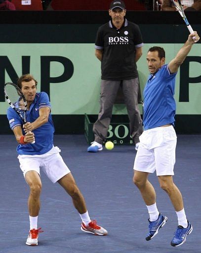 France&#039;s Julien Benneteau (L) and Michael Llodra play Davis Cup doubles on February 2, 2012 in Rouen