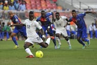 Ghana's midfielder Mubarak Wakaso (foreground) scores a penalty on February 2, 2013 in Port Elizabeth