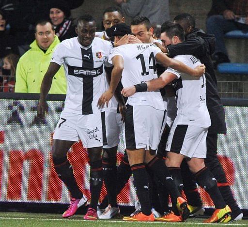 Rennes&#039; Axel Ngando (C)celebrates with teammates after scoring on February 2, 2013 at the Moustoir Stadium in Lorient
