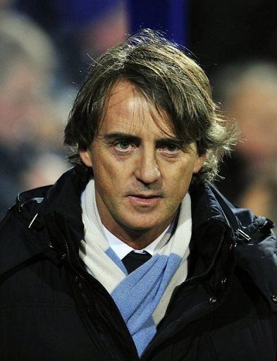 Manchester City manager Roberto Mancini watches the match against Queens Park Rangers in London, January 29, 2013