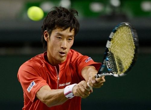 Japan's Yuichi Sugita returns a shot to Indonesia's Christopher Rungkat in the Davis Cup in Tokyo on February 3, 2013