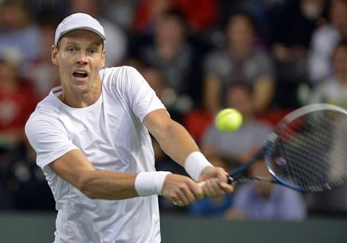 Tomas Berdych of the Czech Republic returns a shot on February 3, 2013, in Geneva