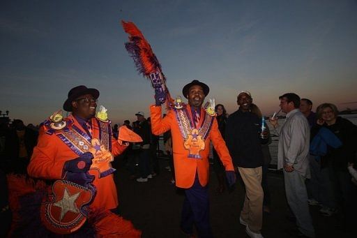 People walk by the river at Woldenburg Park prior to Super Bowl XLVII on February 2, 2013 in New Orleans, Louisiana