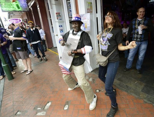 Super Bowl fans and locals party in the French Quarter in New Orleans on Febuary 2, 2013