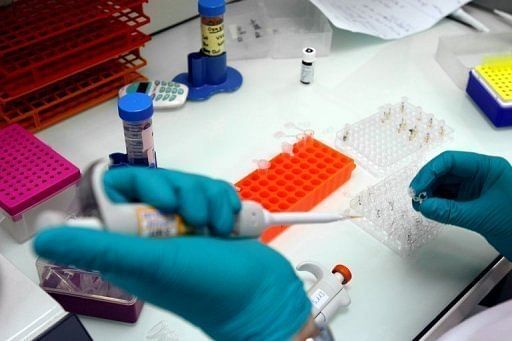 A technician carries out tests on blood samples at an anti-doping laboratory near Paris on June 23, 2008