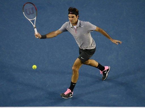 Roger Federer hits a return against Andy Murray in the Australian Open final in Melbourne on January 25, 201