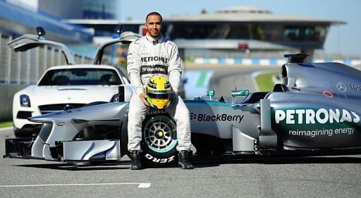 Lewis Hamilton poses with the new Mercedes W04 at Jerez racetrack on February 4, 2013