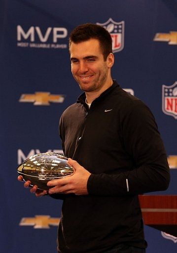 Joe Flacco poses with the MVP trophy on February 4, 2013 in New Orleans