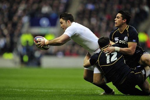 England&#039;s centre Brad Barritt (L) is tackled during a match against Scotland in south-west London on February 2, 2013