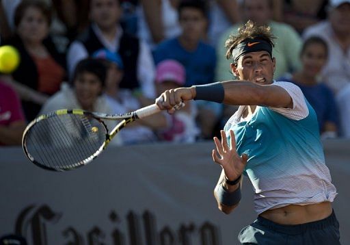 Rafael Nadal hits a return during his doubles match in Chile on February 5, 2013