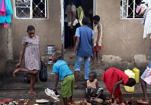 Children gather outside a chess centre in Kampala on January  17, 2013