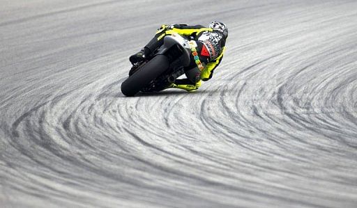 Valentino Rossi of Italy powers his bike at the Sepang circuit outside Kuala Lumpur on February 6, 2013
