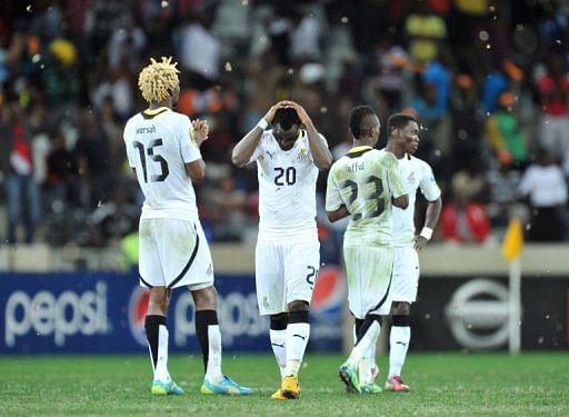 Ghana&#039;s players react at the end of the penalty shootout on February 6, 2013