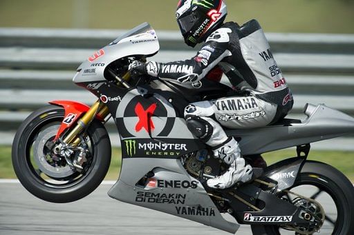 Jorge Lorenzo powers his bike on the final day of the pre-season test at the Sepang circuit on February 7, 2013