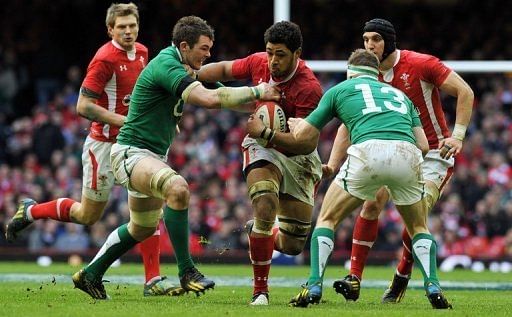 Ireland&#039;s Peter O&#039;Mahony (2L) tackles Wales&#039; Toby Faletau during the Six Nations match in Cardiff on February 2, 2013