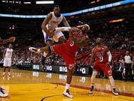 DeAndre Jordan (L) and LeBron James fight for a loose ball, on February 8, 2013