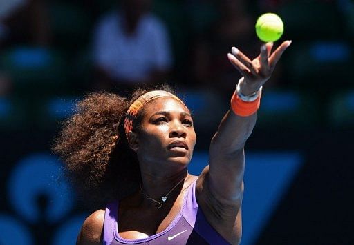 Serena Williams serves against compatriot Sloane Stephens during their clash at the Australian Open on January 23, 2013