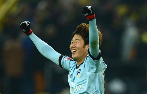 Hamburg&#039;s Korean striker Son Heung-Min celebrates in Dortmund on February 9, 2013