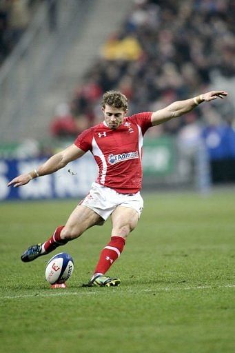 Wales&#039; fly-half Dan Biggar kicks the ball at the Stade de France on February 9, 2013 in Saint-Denis, north of Paris