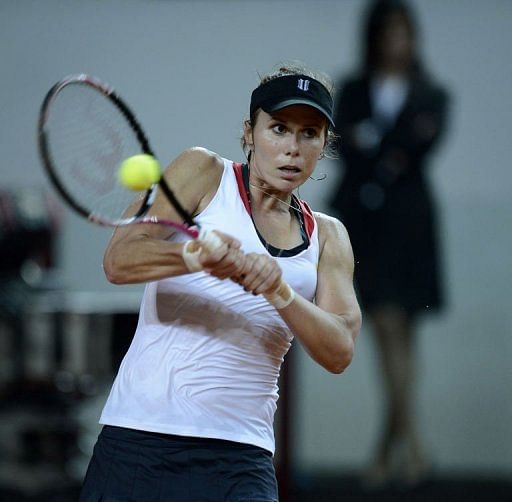 American Varvara Lepchenko returns a ball to Italy&#039;s Roberta Vinci at the Rimini&#039;s 105 Stadium on February 9, 2013