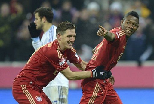 Bayern Munich&#039;s Bastian Schweinsteiger (L) and David Alaba celebrate in Munich, southern Germany, on February 9, 2013