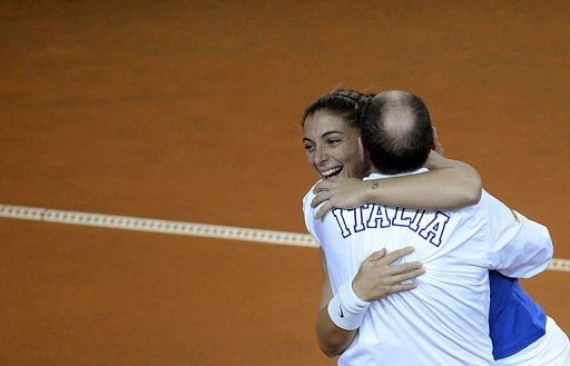 Italy&#039;s Sara Errani (L) embraces coach Corrado Barazutti in Rimini&#039;s 105 Stadium on February 10, 2013