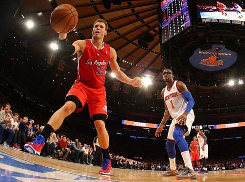 Blake Griffin of the Clippers reaches for the ball as Amar'e Stoudemire of the Knicks looks on February 10, 2013 in NY