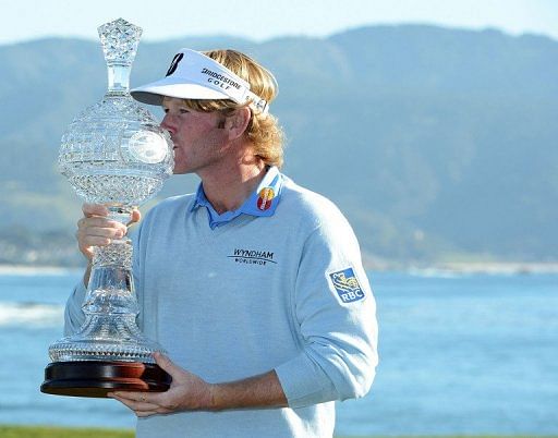 Brandt Snedeker poses with the trophy on February 10, 2013 in Pebble Beach, California