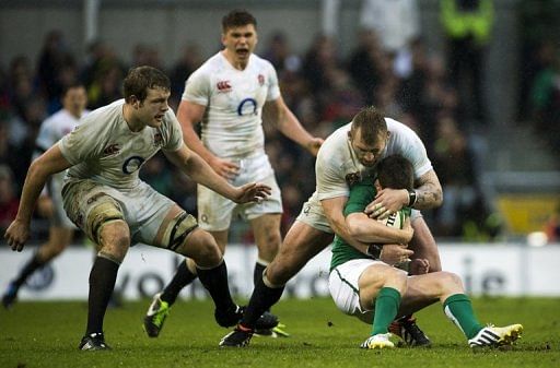 England&#039;s Joe Marler (2nd R) tackles Ireland&#039;s Ronan O&#039;Gara, in Dublin, on February 10, 2013