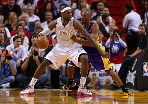 Kobe Bryant of the Los Angeles Lakers guards LeBron James of the Miami Heat  February 10, 2013 in Miami