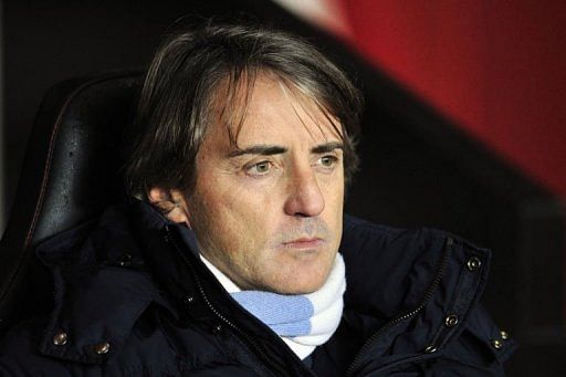 Roberto Mancini sits in his seat during the match between Southampton and City in Southampton on February 9, 2013