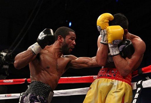 Lamont Peterson punches Amir Khan on December 10, 2011 in Washington, DC