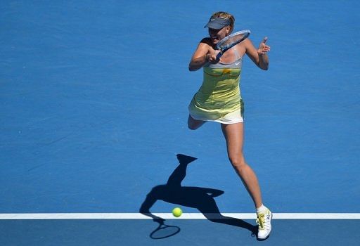 Maria Sharapova hits a return against China&#039;s Li Na during their semi-final at the Australian Open on January 24, 2013