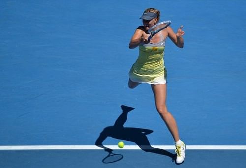 Maria Sharapova hits a return against China's Li Na during their semi-final at the Australian Open on January 24, 2013