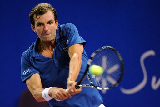 France&#039;s Julien Benneteau returns the ball on February 8, 2013 in Montpellier