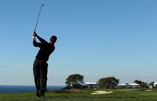 Tiger Woods hits a shot at Torrey Pines Golf Course on January 28, 2013 in La Jolla, California