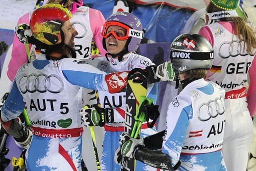 Austria&#039;s Michaela Kirchgasser (C) celebrates with Marcel Hirscher  in Schladming, Austria on February 12, 2013