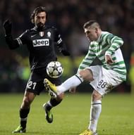 Celtic's Gary Hooper (R) vies with Juve's Andrea Pirlo in Glasgow, Scotland, on February 12, 2013