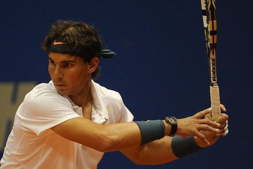 Rafael Nadal returns during a doubles match with Argentinian David Nalbandian, at the Brazil Open, on February 12, 2013