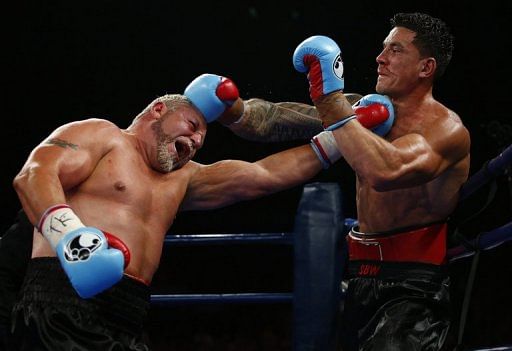 South Africa&#039;s Francois Botha (L) and New Zealand&#039;s Sonny Bill Williams during their fight in Brisbane, February 8, 2013