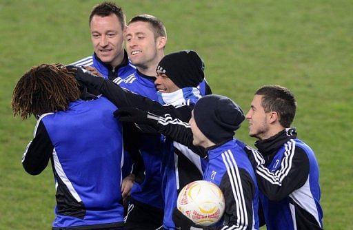 Chelsea players enjoy a joke during training on February 13, 2013, on the eve of their Europa League match