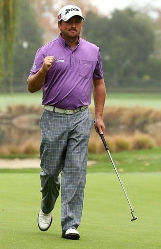 Graeme McDowell pumps his fist after making a birdie putt during the Tiger Woods World Challenge on December 1, 2012