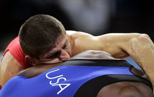 Ukraine&#039;s Elbrus Tedeyev battles Jamill Kelly of the United States at the 2004 Olympics in Athens, on August 28, 2004