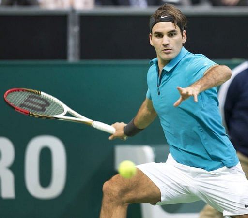 Roger Federer returns the ball to Grega Zemlja in Rotterdam, on February 13, 2013