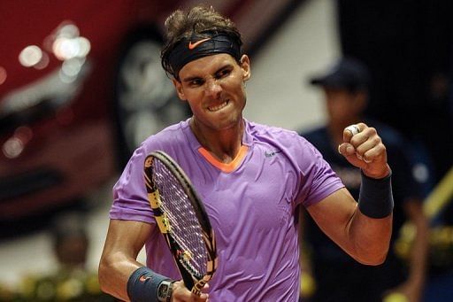 Rafael Nadal celebrates winning his Brazil Open match on February 14, 2013