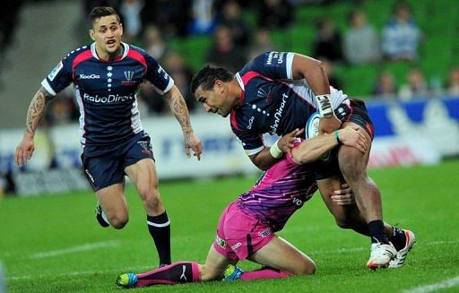 Melbourne Rebels&#039; Cooper Vuna (R) is tackled by a Northern Bulls player, in Melbourne, on May 4, 2012