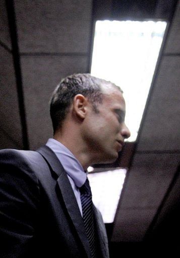 South Africa&#039;s Olympic sprinter Oscar Pistorius leaves the courtroom in Pretoria  on February 15, 2013