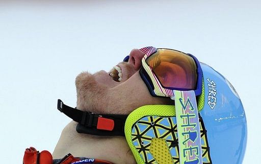 Ted Ligety celebrates after winning the men&#039;s giant slalom  world title in Schladming on February 15, 2013