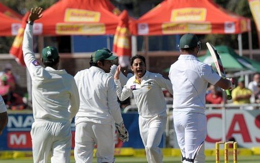 Saeed Ajmal (centre) celebrates the wicket of Jacques Kallis in Cape Town on February 15, 2013