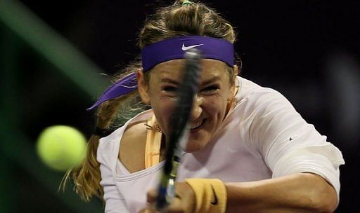 Belarus Victoria Azarenka hits a return to Sara Errani of Italy on February 15, 2013 in Doha